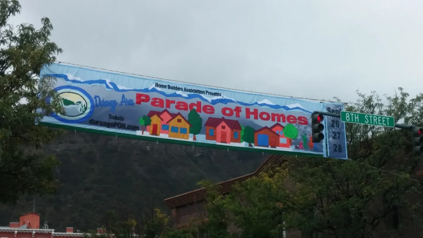 A large banner with houses and trees on it.