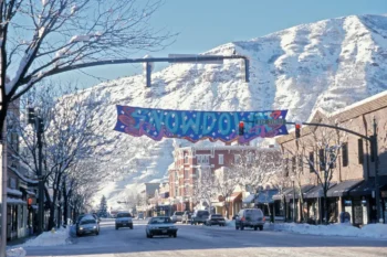 Snowdown banner above a snowy downtown street.